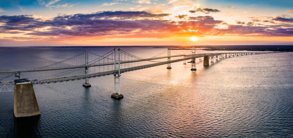 Aerial panorama of Chesapeake Bay Bridge at sunset. The Chesapeake Bay Bridge (known locally as the Bay Bridge) is a major dual-span bridge in the U.S. state of Maryland.